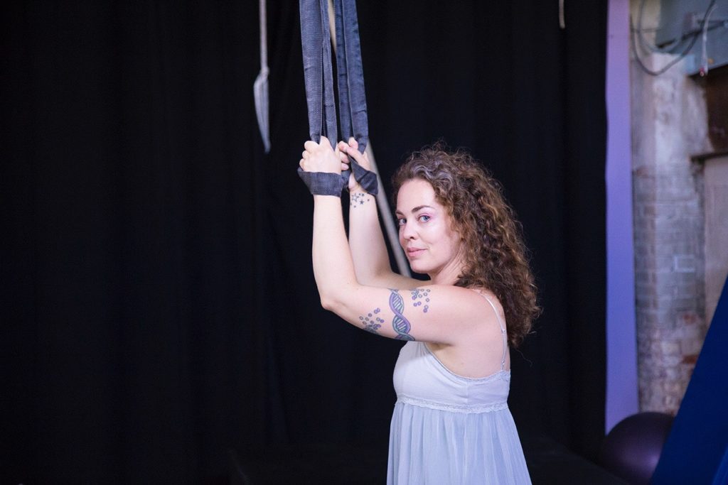 Lauren Kehl posing with aerial fitness equipment